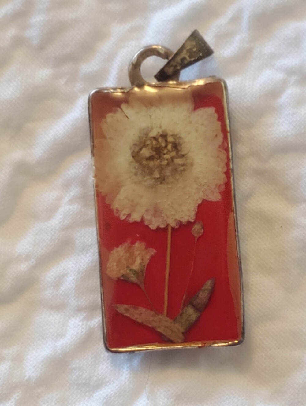 Pressed White Flower Rectangle Pendant on Red Background